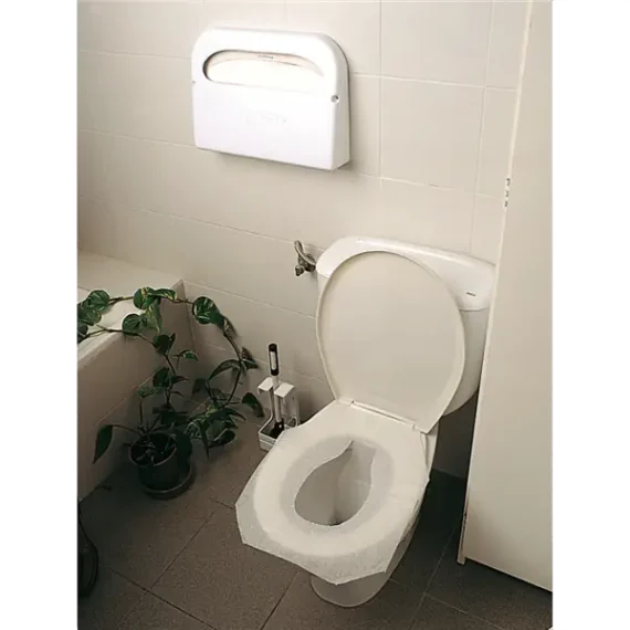 Detalle Instalación Dispensador papel cobertor wc blanco.